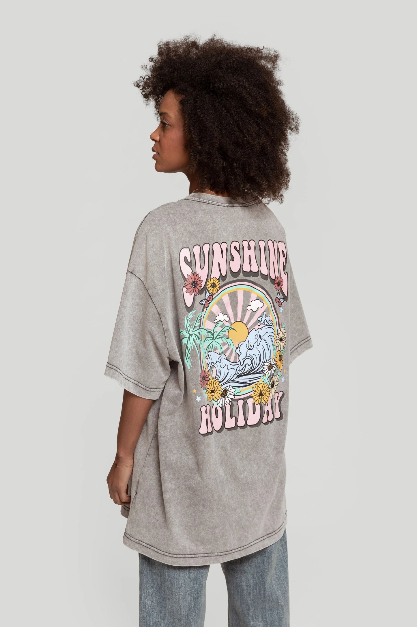 SUNSHINE HOLIDAY | T-shirt oversized com estampado colorido
